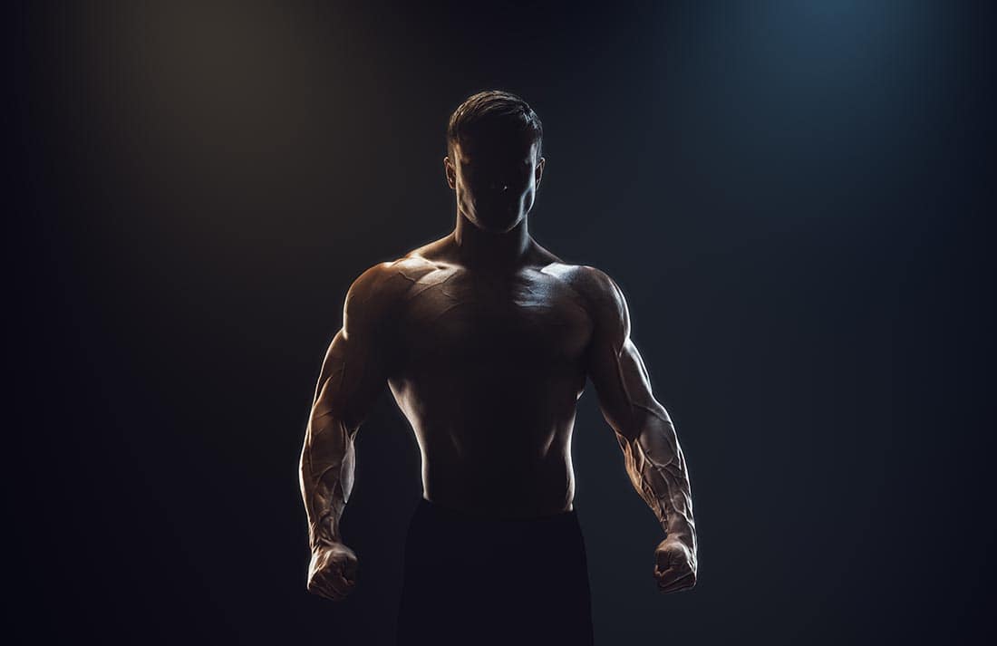 Male Bodybuilder in back light
