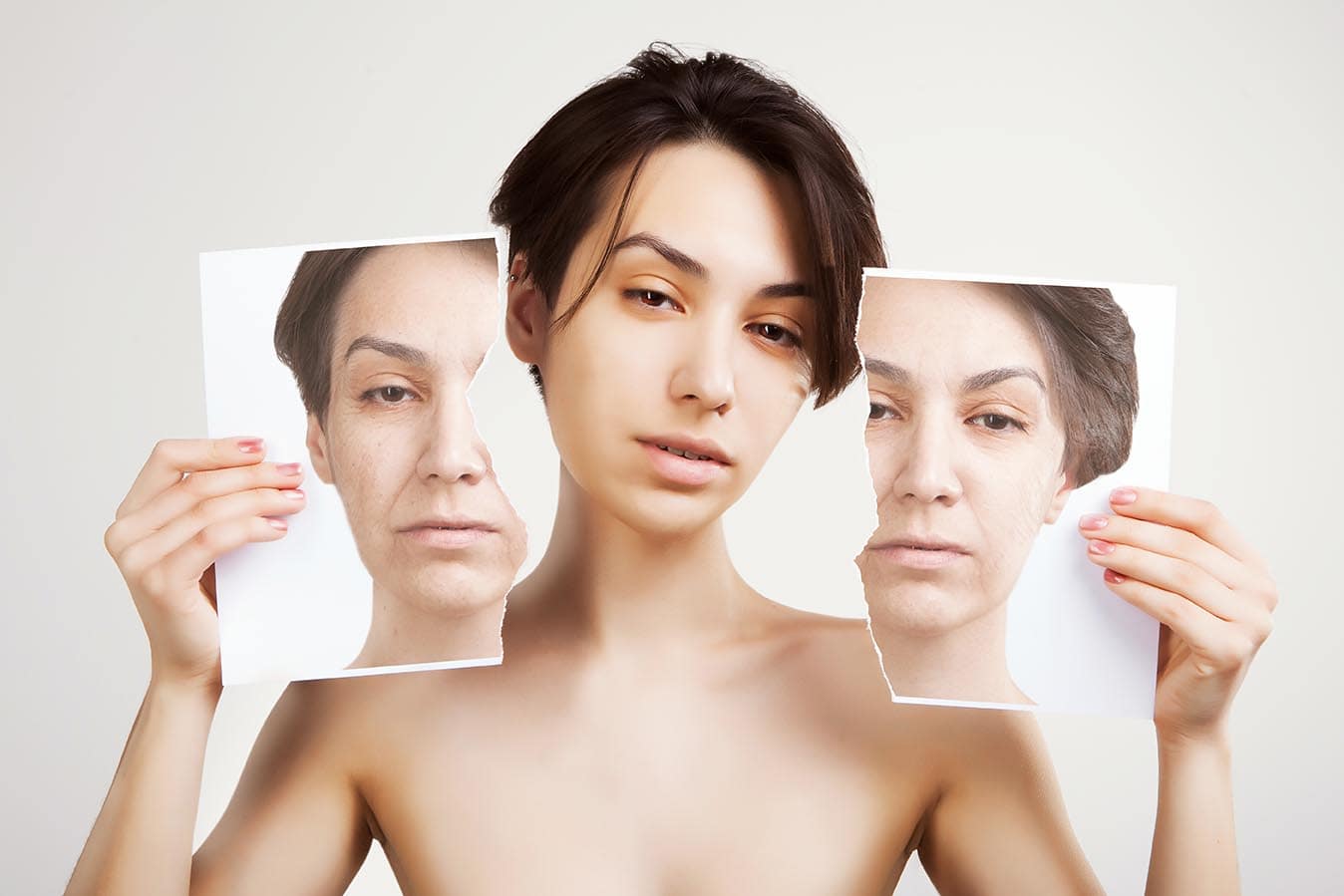 Woman showing pictures from before and after