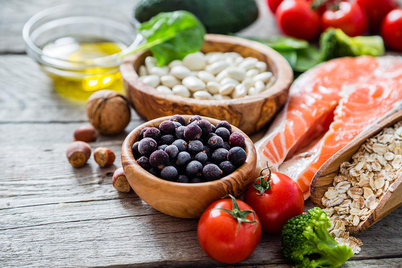 Healthy diet salmon, berrys, tomatoes and salad